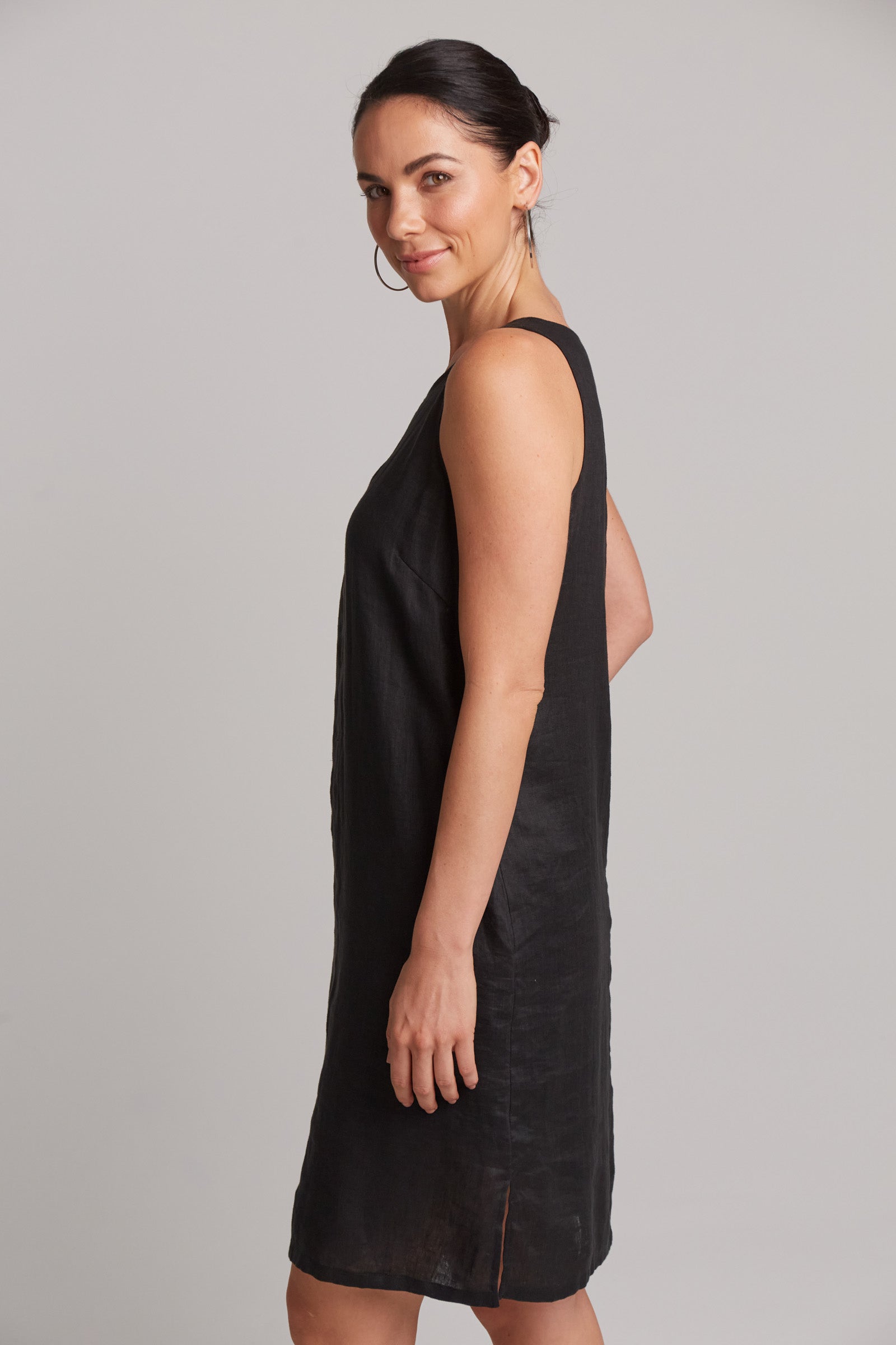 just above knee black studio midi dress, side view sleeveless