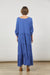 Back View of Azure Blue maxi tiered dress with long tabbed sleeves by Isle of Mine