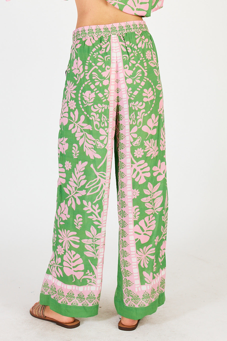 Back of ladies Carara green and pink summer pants with a leafy print by LulaSoul.