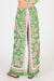 Back of ladies Carara green and pink summer pants with a leafy print by LulaSoul.