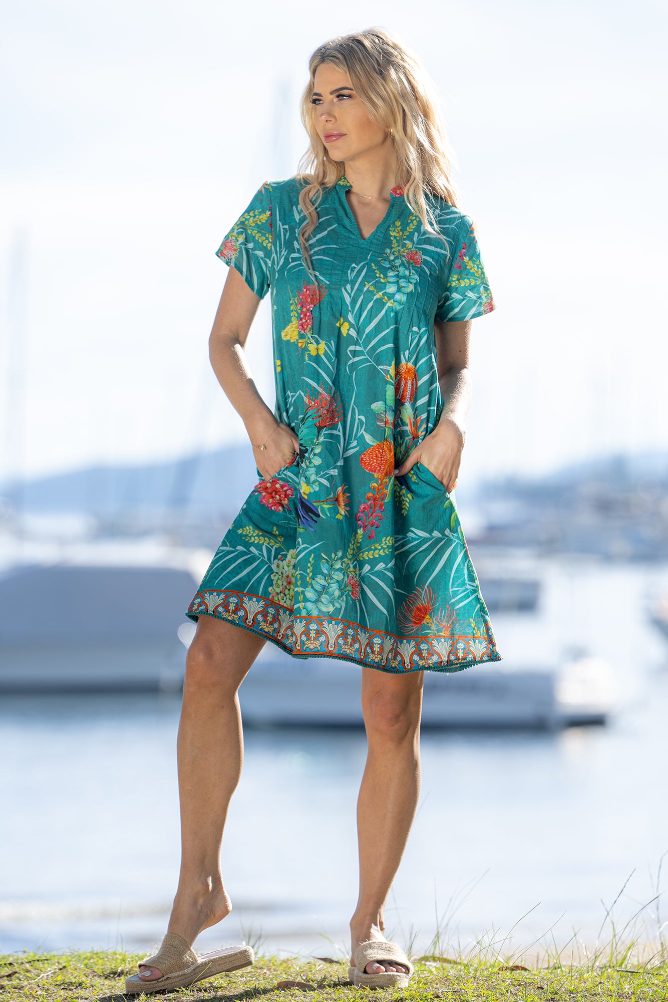 Ladies cotton turquoise floral lorikeet print midi dress with pockets by Cienna.