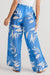 passion flower fly away pants ladies blue and white leaf print trousers.