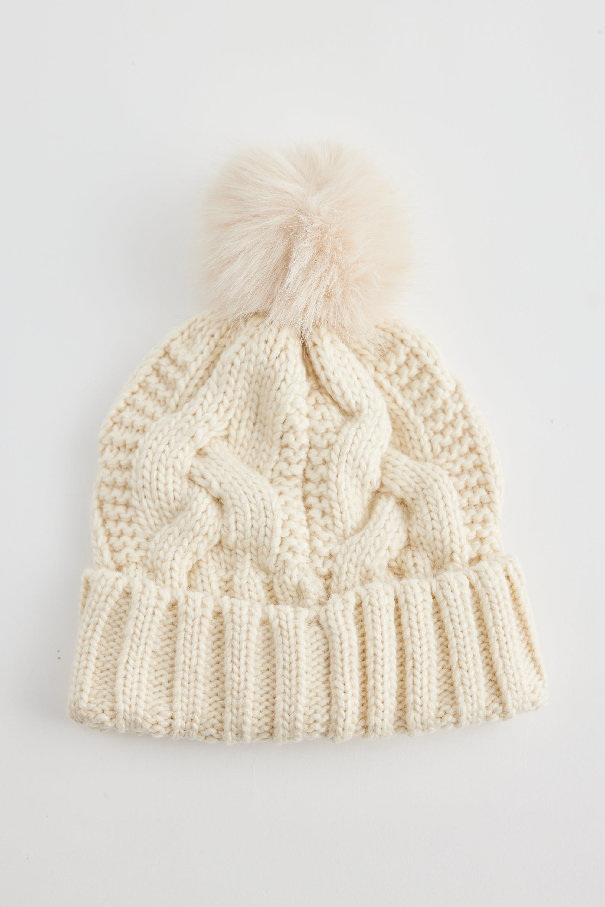 Cable knit Frosty Beanie in White Cream Creme with faux fur pom pom by Holiday