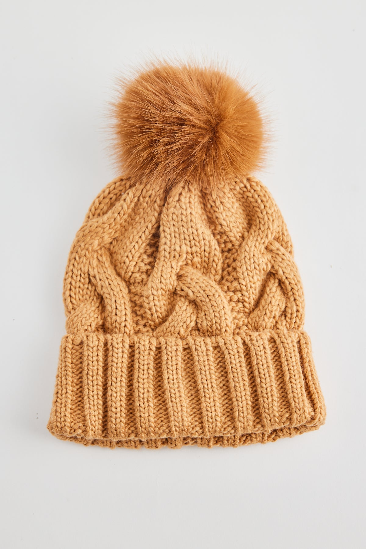 Cable knit Frosty Beanie in Tan Brown with faux fur pom pom by Holiday