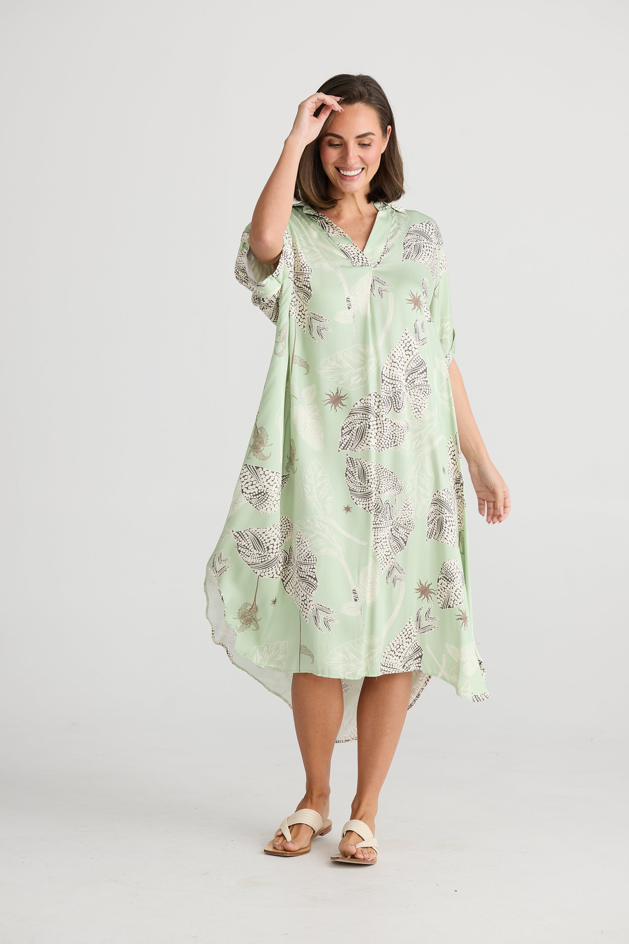 Modle in Cayman Overshirt Midi Dress in Waterlily by Holiday.