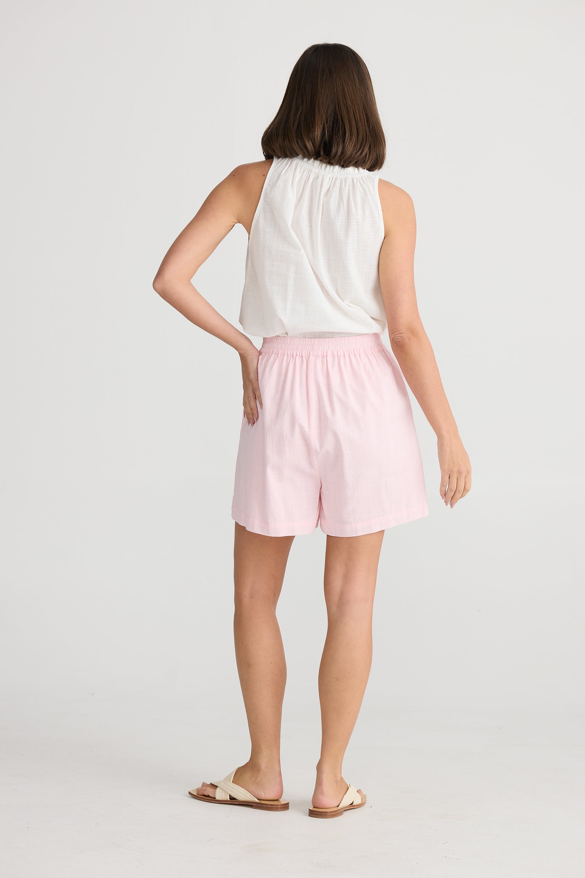 Back of Holiday's Women's cotton Playa Shorts in Pink with pockets.