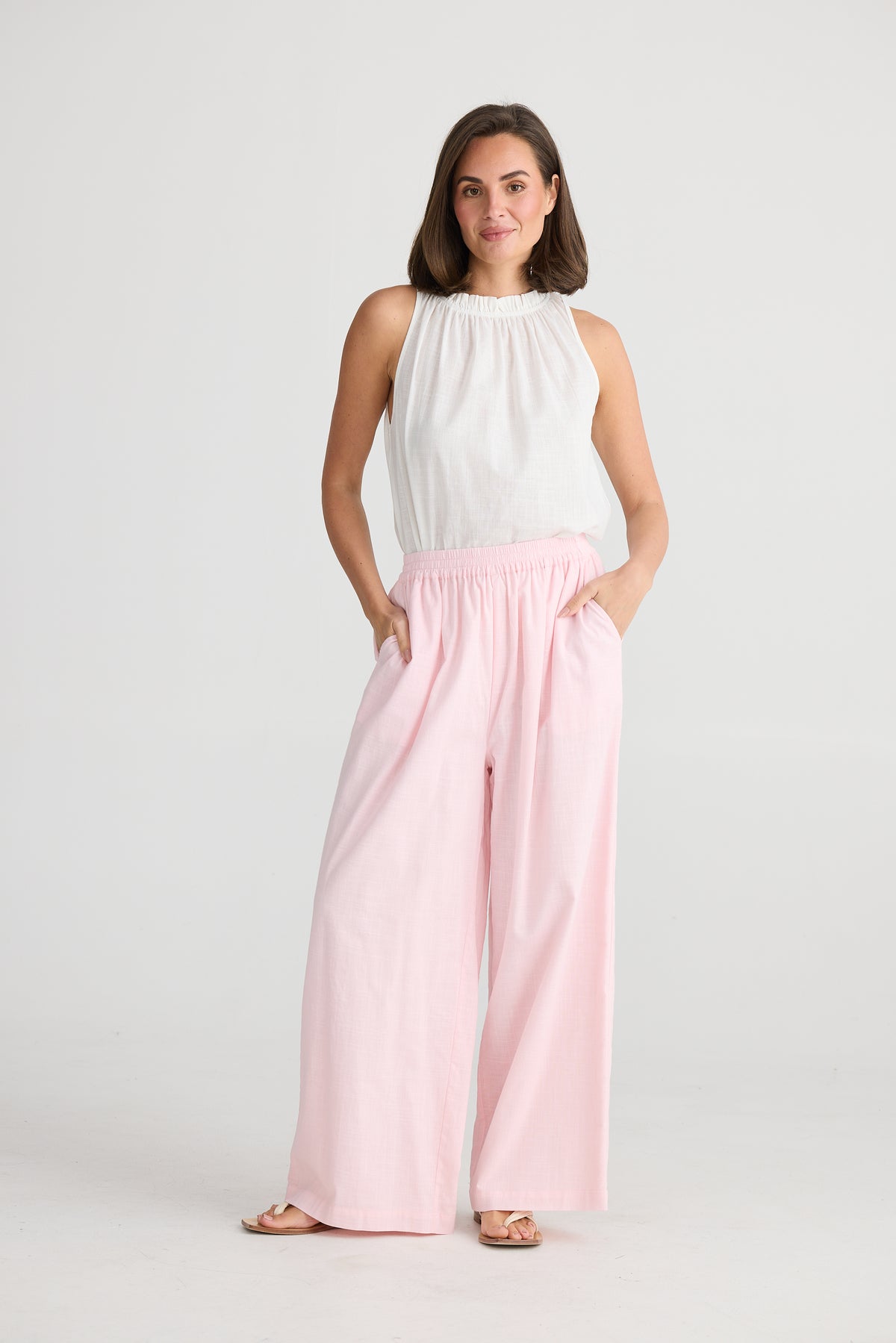 Model wearing Holiday Clothing&#39;s Pink Playa Cotton Pants.