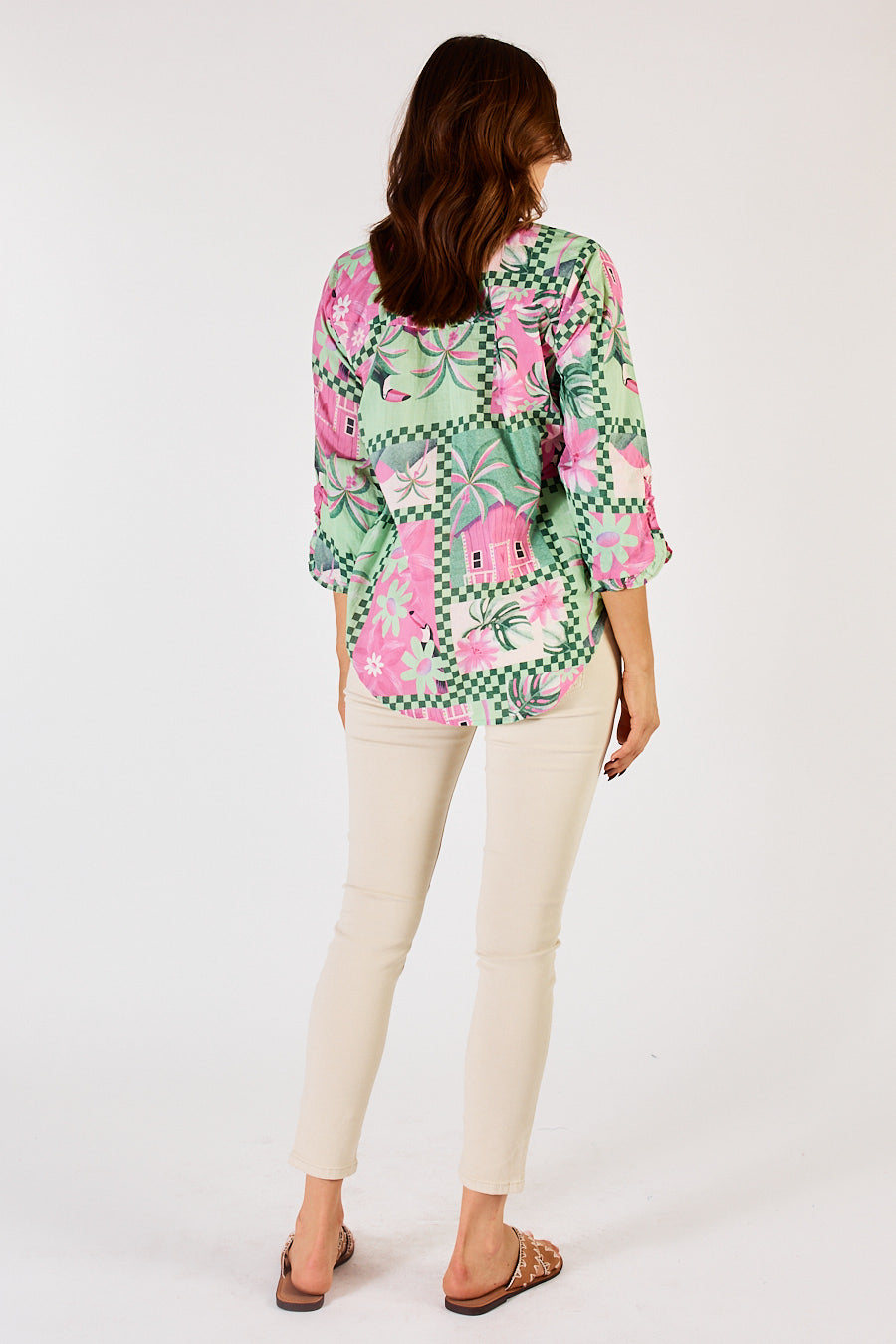 Back of Audrey shirt by Lulalife, it has a curved hem and grandpa collar in a fun tropical print. 