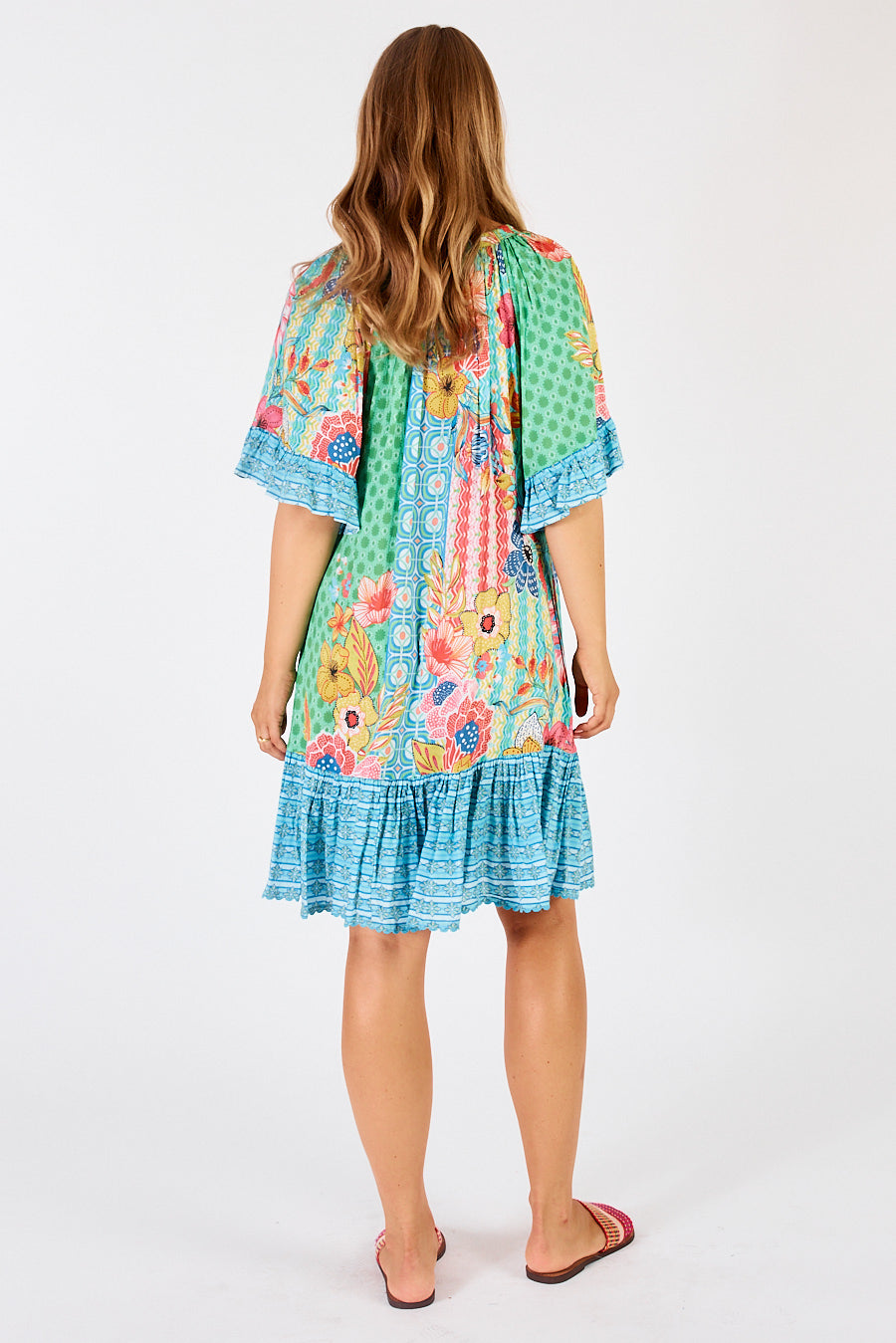 Back of Miranda Shirred Midi Dress in Sea a floral and geometric dress in green, blue, pink and yellow by LulaLife. 