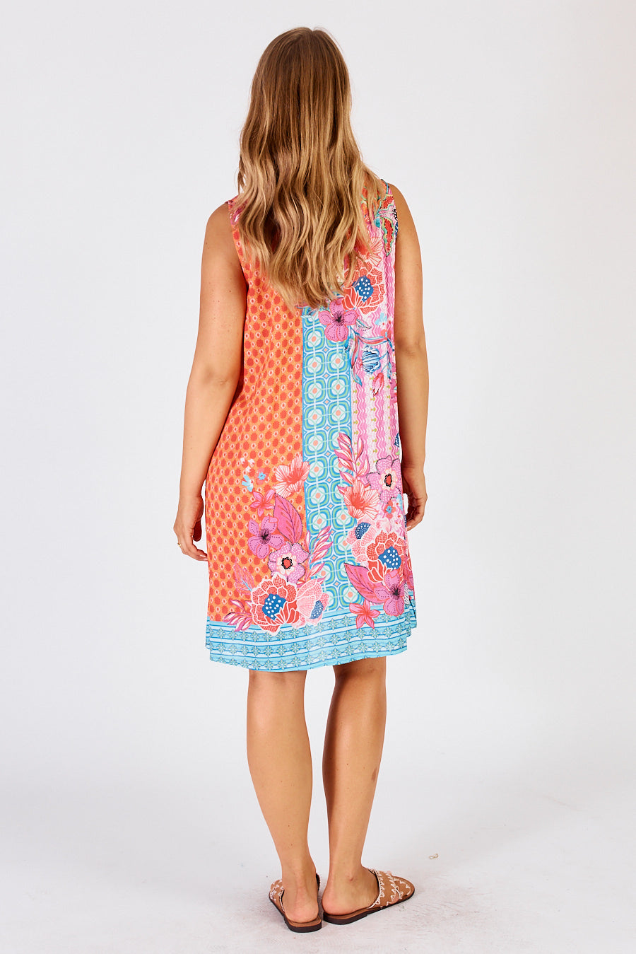 Back of Miranda Swing Shift Midi Dress in orange, blue and pink, floral striped geometric print b by LulaLife.