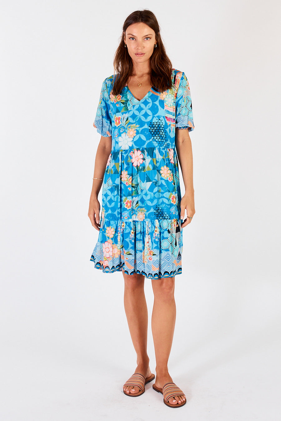 LuLaSoul&#39;s Amalfi Midi Dress in blue floral and geometric print with v-neck, short sleeves and is tiered.