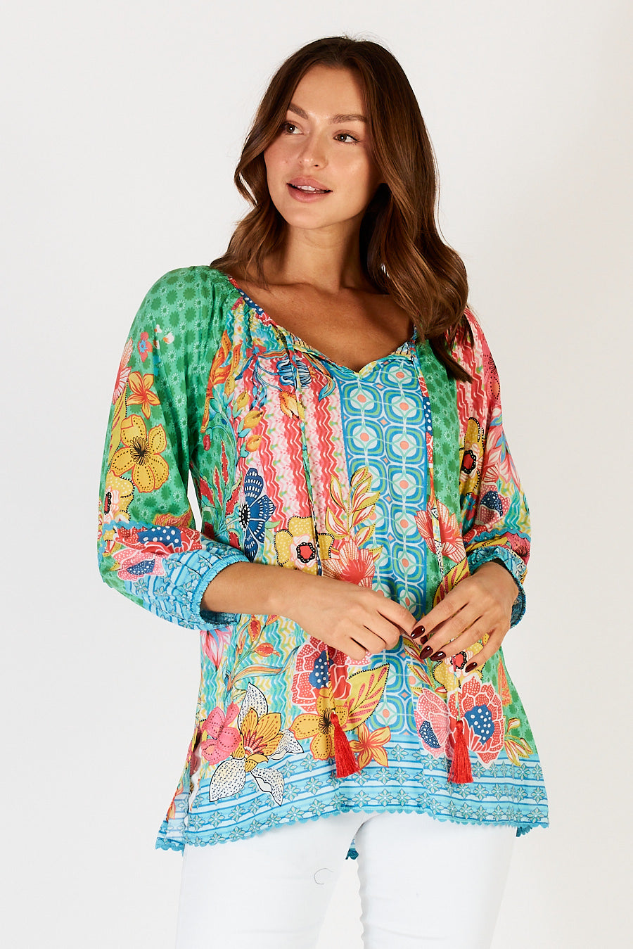 LulaLife&#39;s Miranda Top in Sea a fun bright green, blue, yellow and pink top with floral and geometric print.