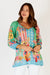 LulaLife's Miranda Top in Sea a fun bright green, blue, yellow and pink top with floral and geometric print.