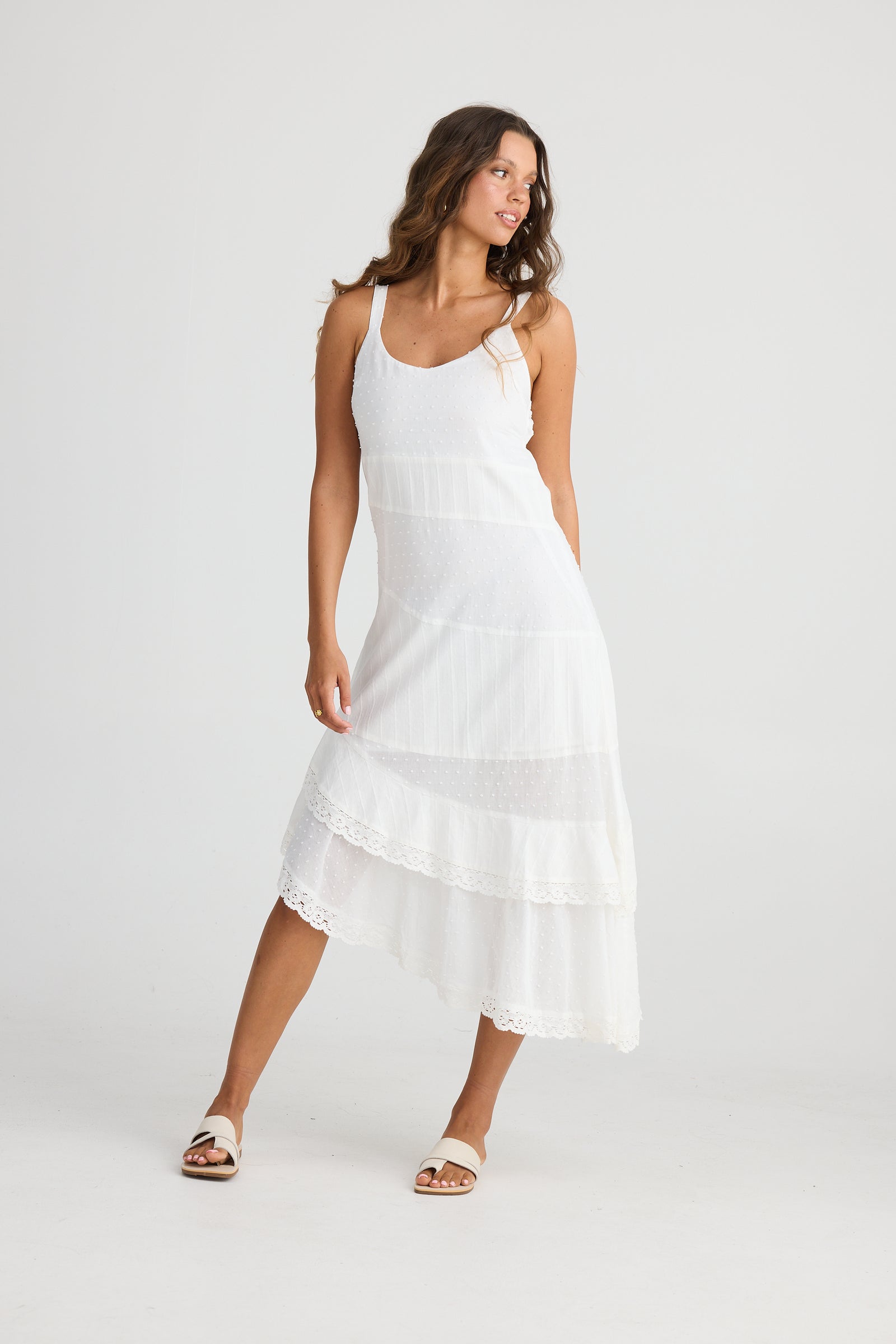 Talisman Anita Dress in White with an asymmetrical hem line with contrasting material stripes.