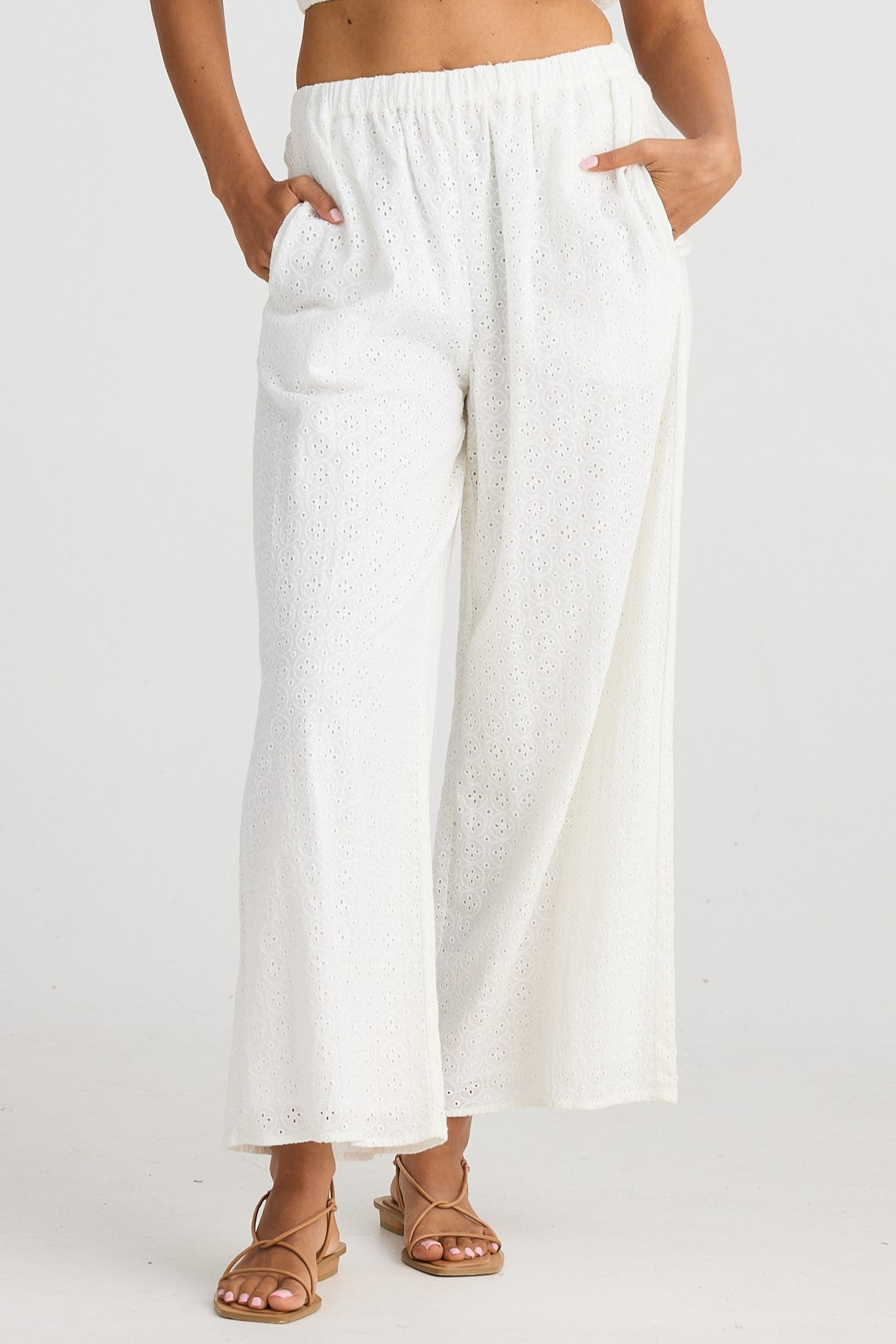 White Cotton Pants with eyelet embroidery in a relaxed fit with an elasticated waist.