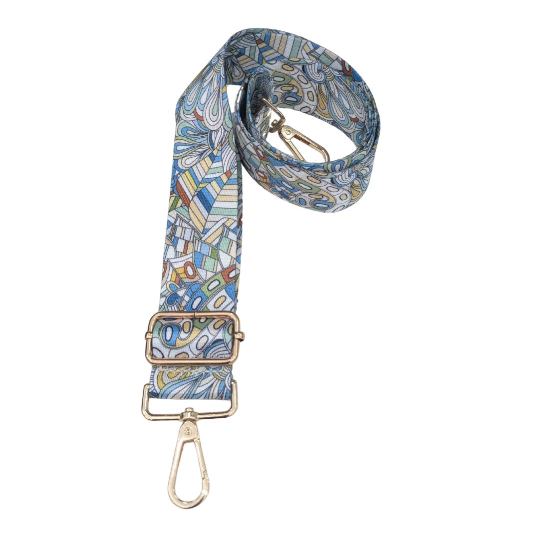 Vibrant Bag Strap with Gold Hardware and print in blues greens and yellows.