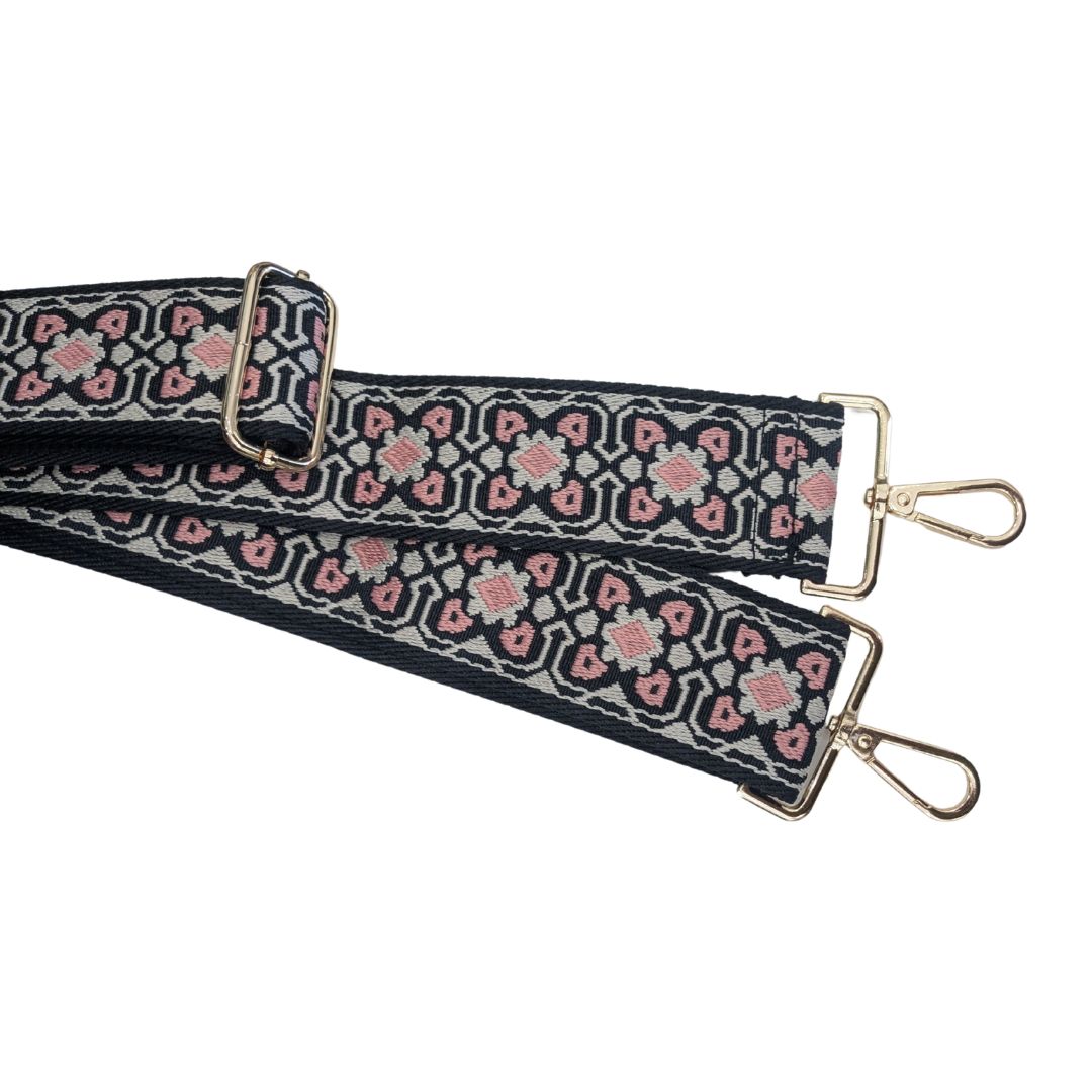 Bag strap with flower geometric print in black white and pink.