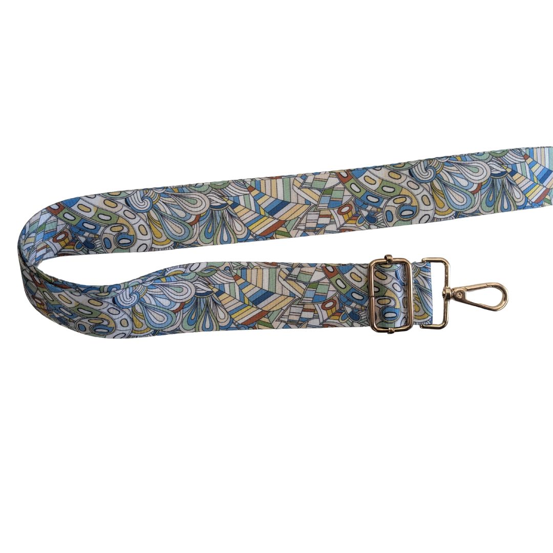 Vibrant Bag Strap with Gold Hardware and print in blues greens and yellows.