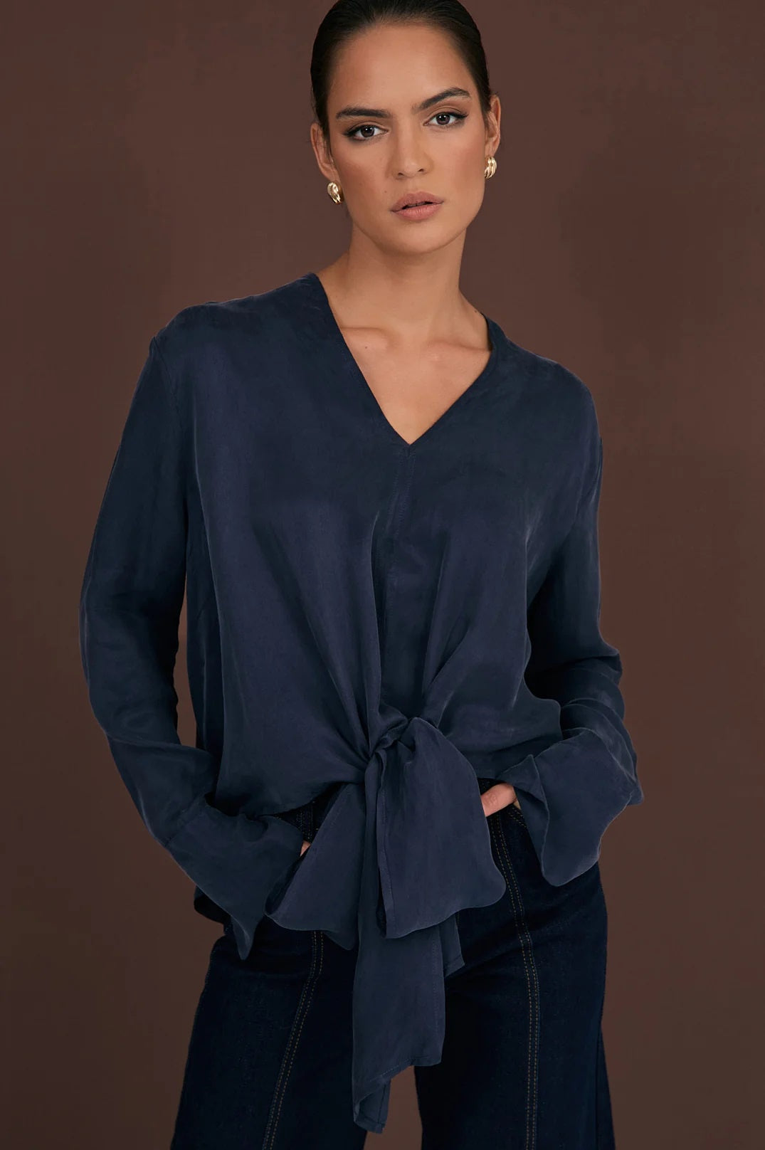 Adorne Rylie Cupro Top in Navy Blue with long sleeves and a tie front.