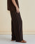 Side View of Betty Basics Women's linen blend brown and black striped Tamara pants in Chocolate Stripe.