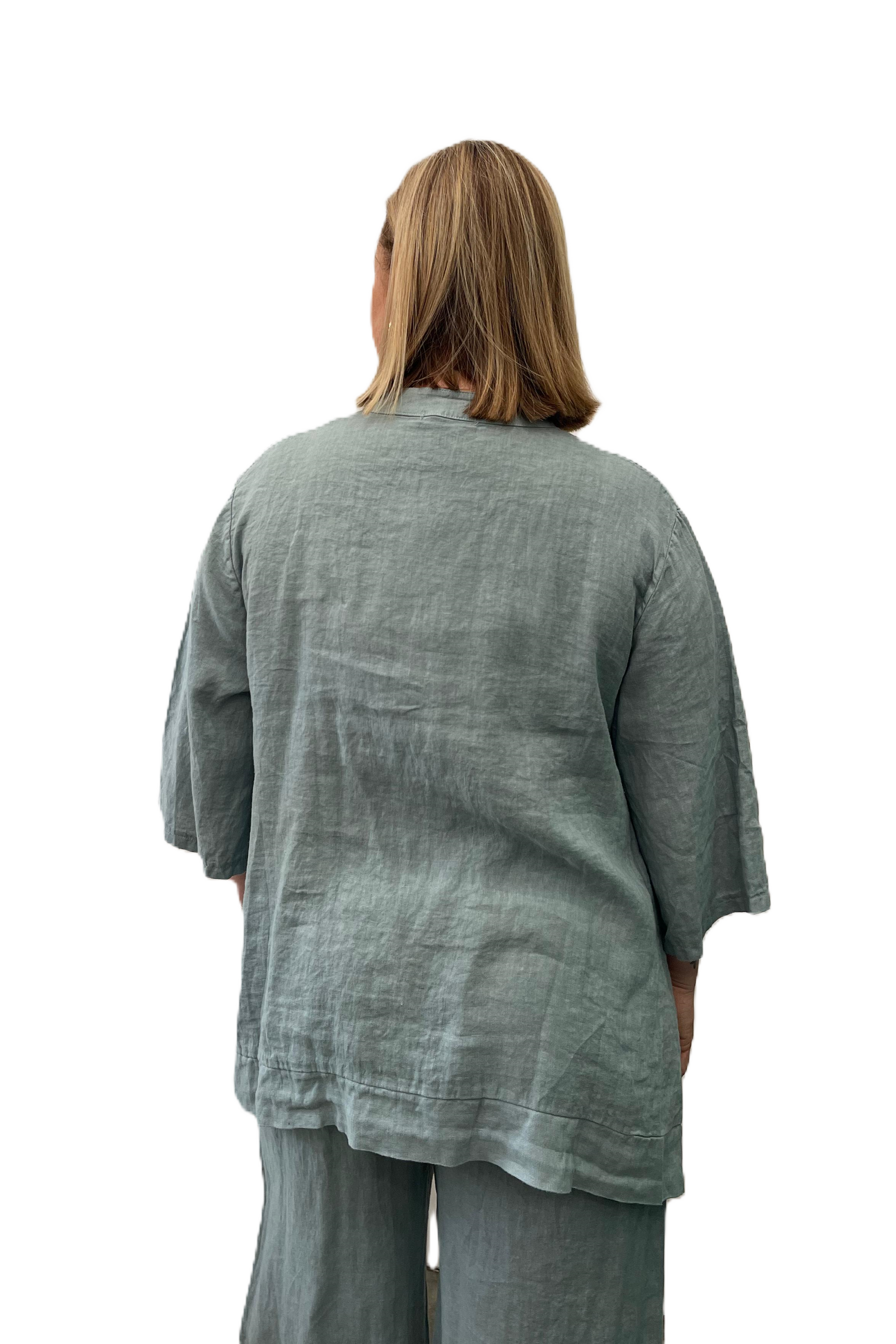 Back of blue linen ladies top from The Italian cartel, long relaxed oversized linen blouse.