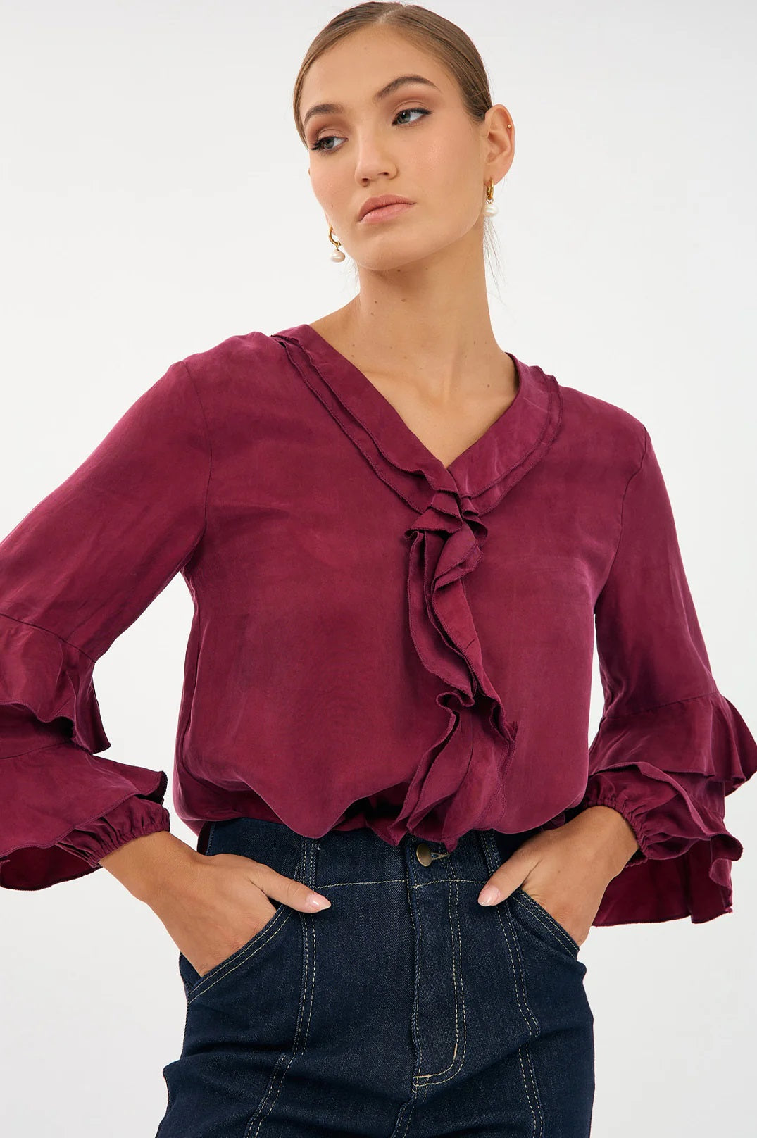 Adorme's long sleeve Marla ruffled blouse top in burgundy with detail on sleeves, collar and placard.