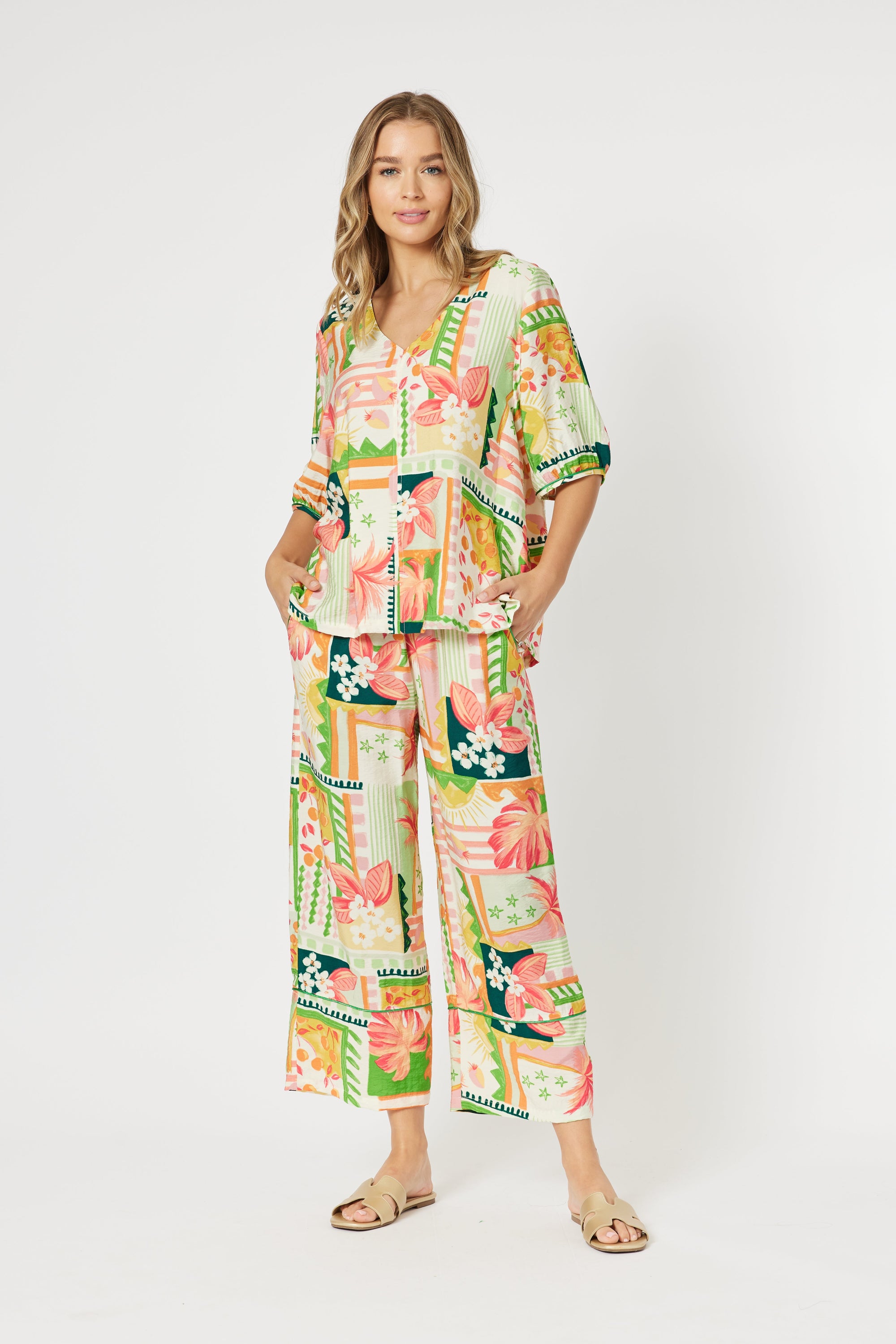 Floral and geometric print top in green, pink, white and yellow with VNeck, elasticated sleeves and relaxed fit.