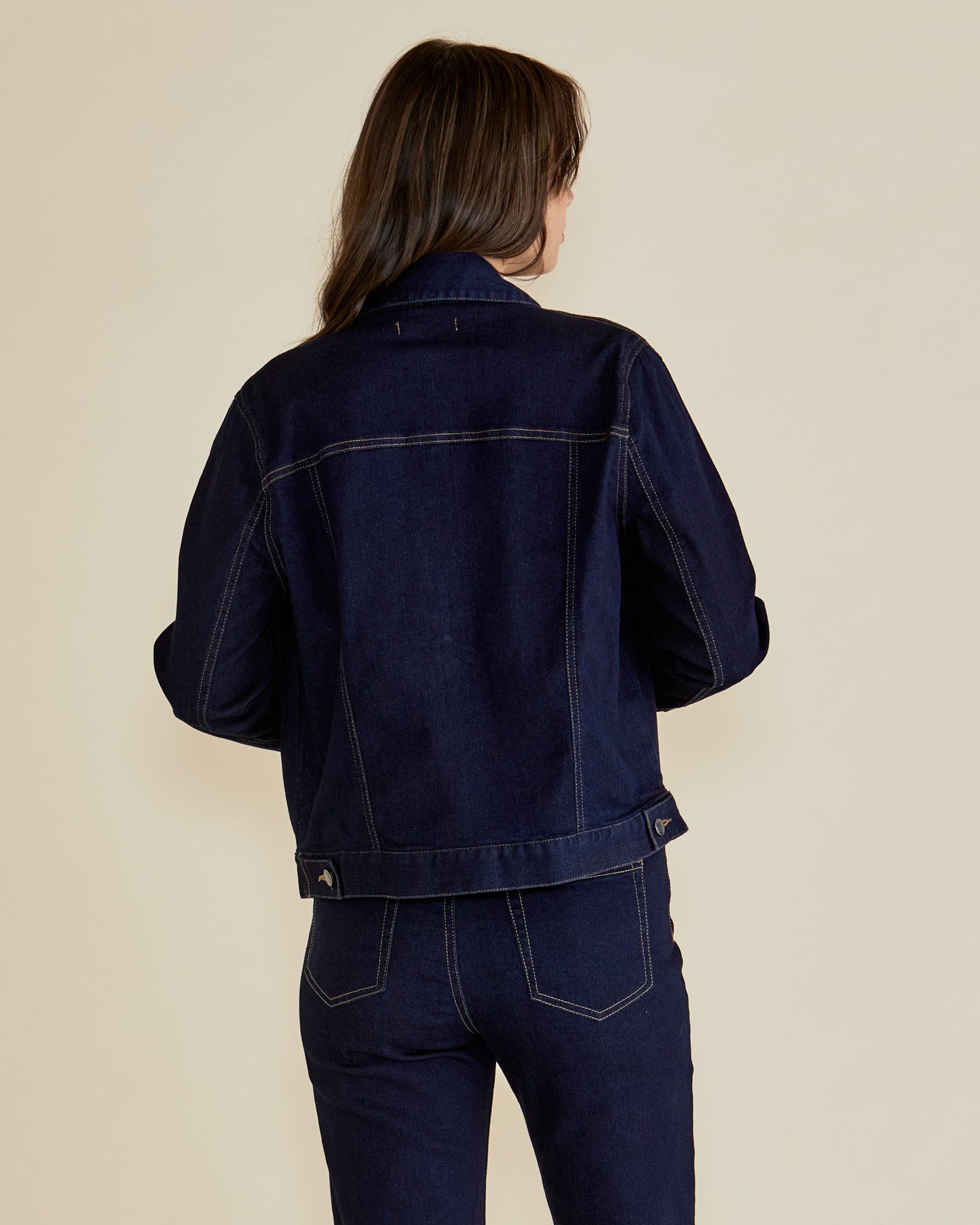 Back of Dark Blue Women's denim jacket by Betty Basics.