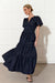 Dark blue ladies denim maxi dress with tiered skirt, shirred waist and gathered details by adorne. 