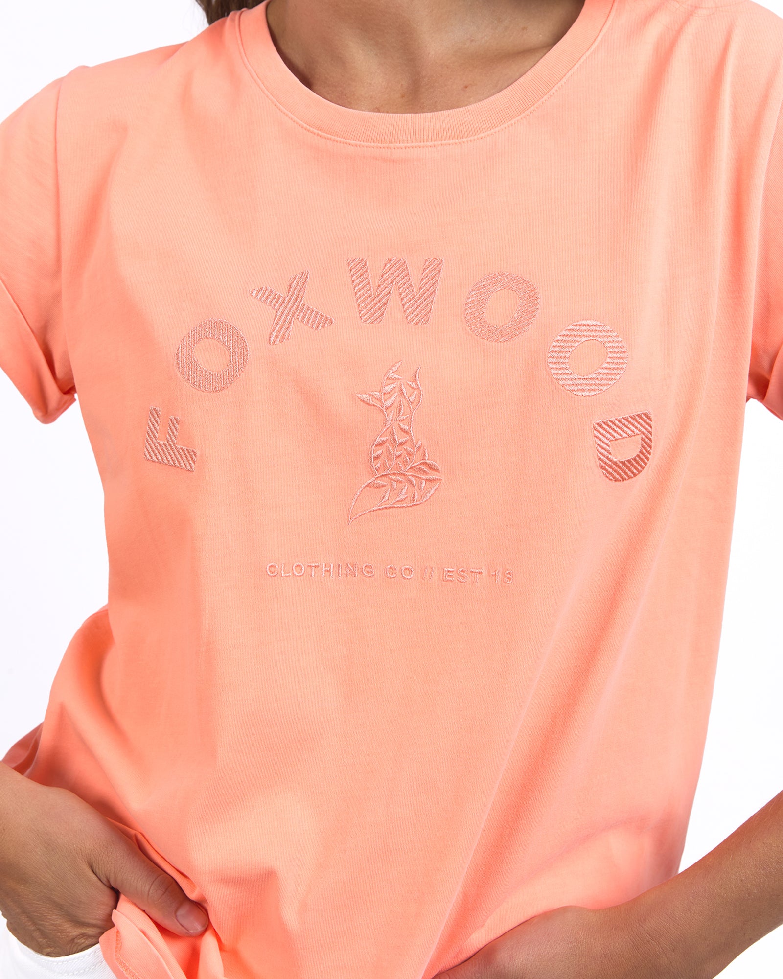 Ladies orange short sleeve tee with an embroidred fox and foxwood name on front. 