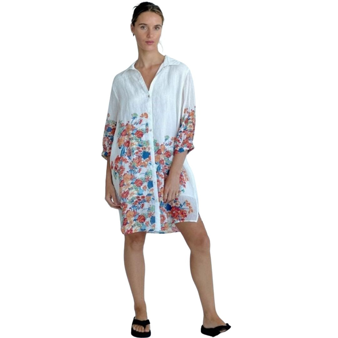 Garden Party Shirt Dress in White with flowers in blue, red green and orange with classic collar and button up front. 