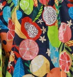 Swatch of Fruit Forest Andi Dress in Blue, yellow, red and overed in citrus fruit print by Maude Vivante.