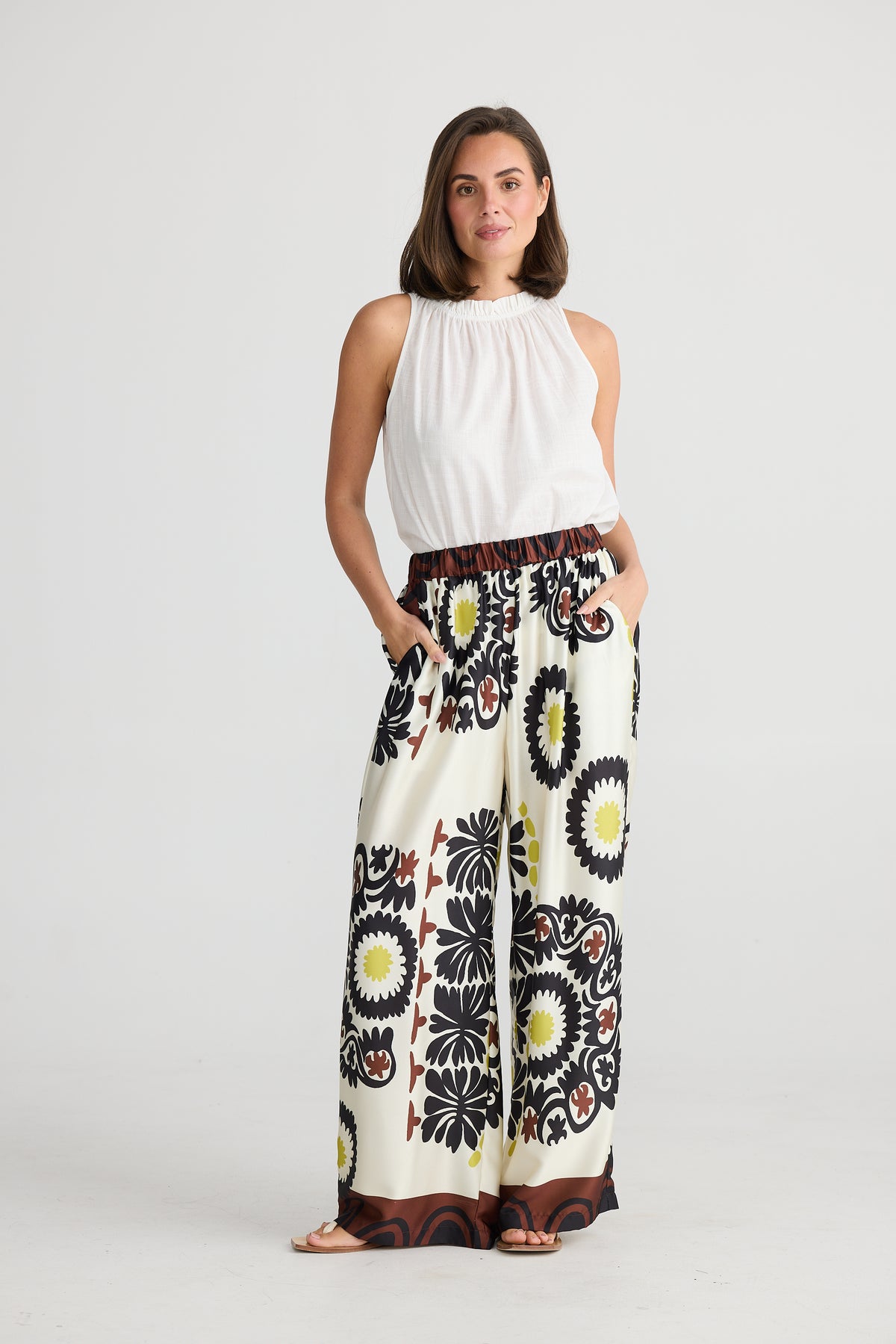 Model wearing Holiday&#39;s Playa Wide Leg Pants in Island Time print.