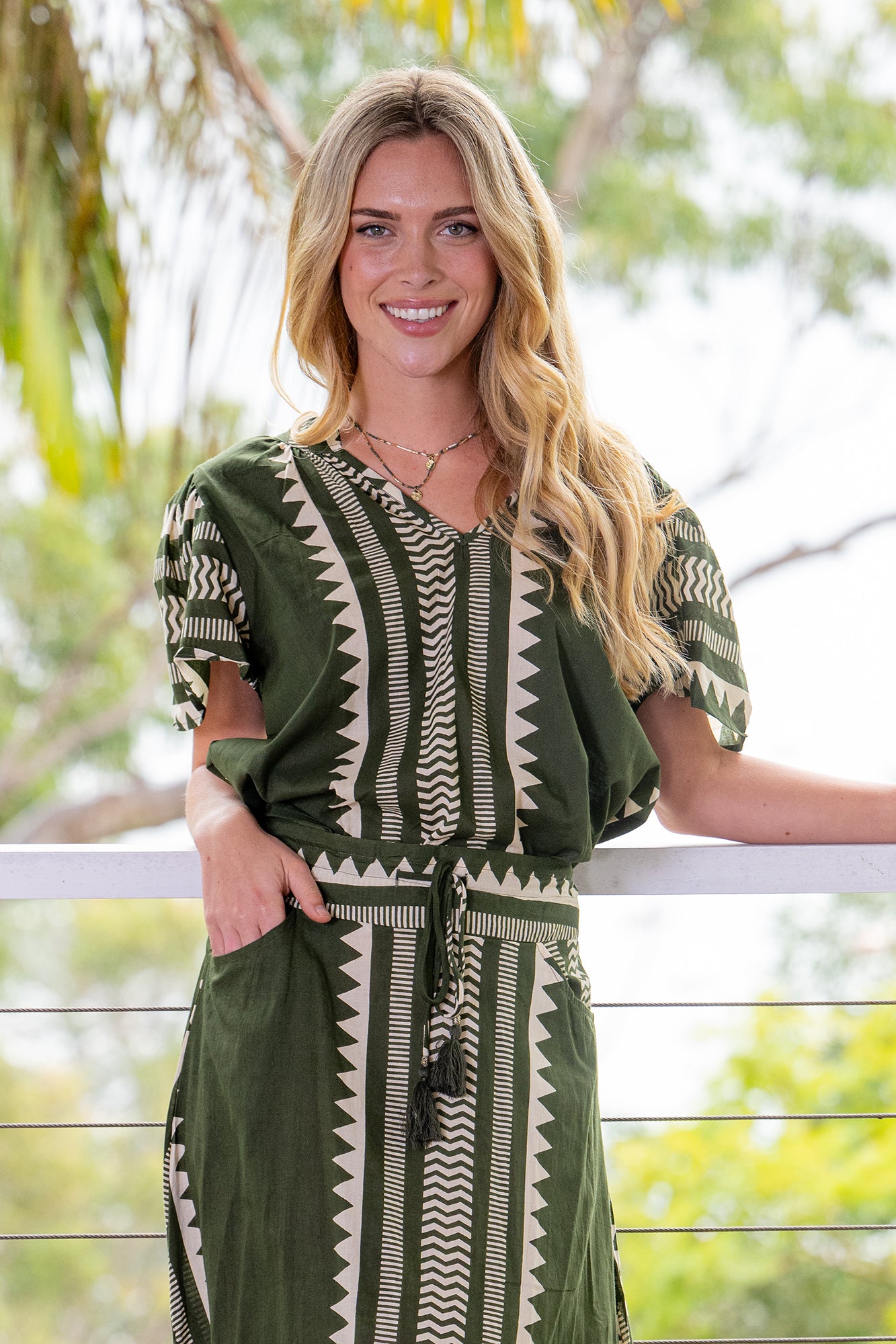 Cienna's Karri short sleeve blouse in khaki green and cream with geometric triangle line and slight zig zag print. 