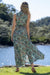 Back of the cienna syrena maxi dress (Sleeveless) in floral green red and gold.