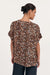 Back of Greta oversized luxe cupro blouse top in Leopard print with shorts sleeves, curved hem and wide round neck by adorne.