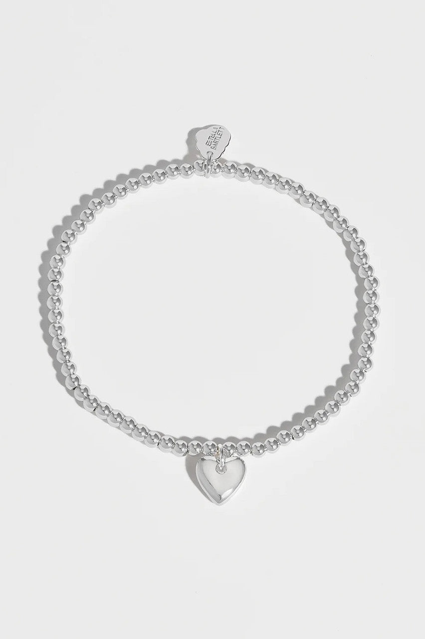 Estella Bartlett Sienna Cushion Heart Charm Bracelet in Silver Plating.