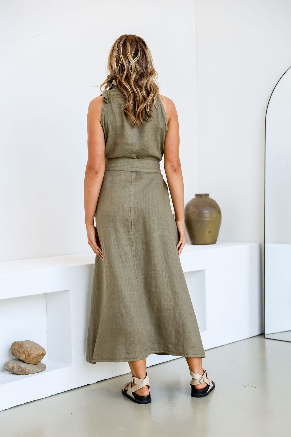 Model wearing Free Angel's Papavero Linen Sleeveless Maxi Dress in Slate a khaki green.