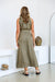 Back of sleeveless maxi linen khaki green dress, belted at the waist for flattering figure.