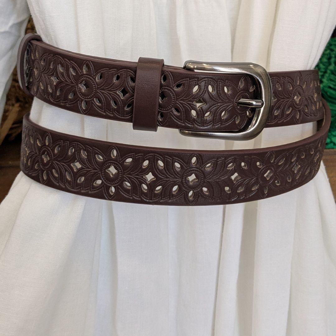 Brown Floral Embossed Belt on Dress showing belt loops and decorative perforation.