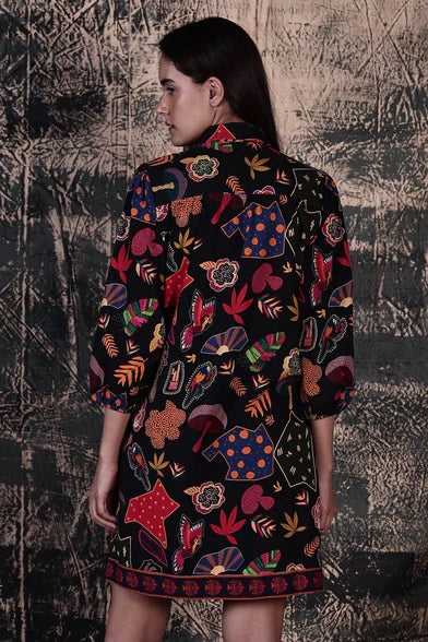 Ava A-line Midi Shirt Dress in Night Glow a bright fun print with collar and button up front, sleeves with elastic cuffs, pockets and contrasting print on hem and placket.