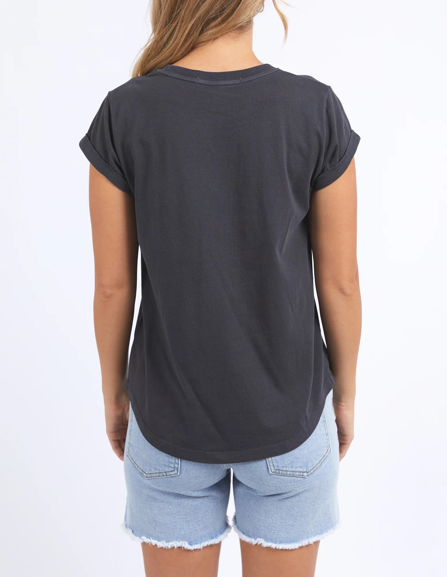 Back view of women's washed black Eva tee with curved hem, short sleeves and round neck.