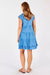 Back of Gwen Tiered Midi Dress in periwinkle blue with capped sleeves and tiers.