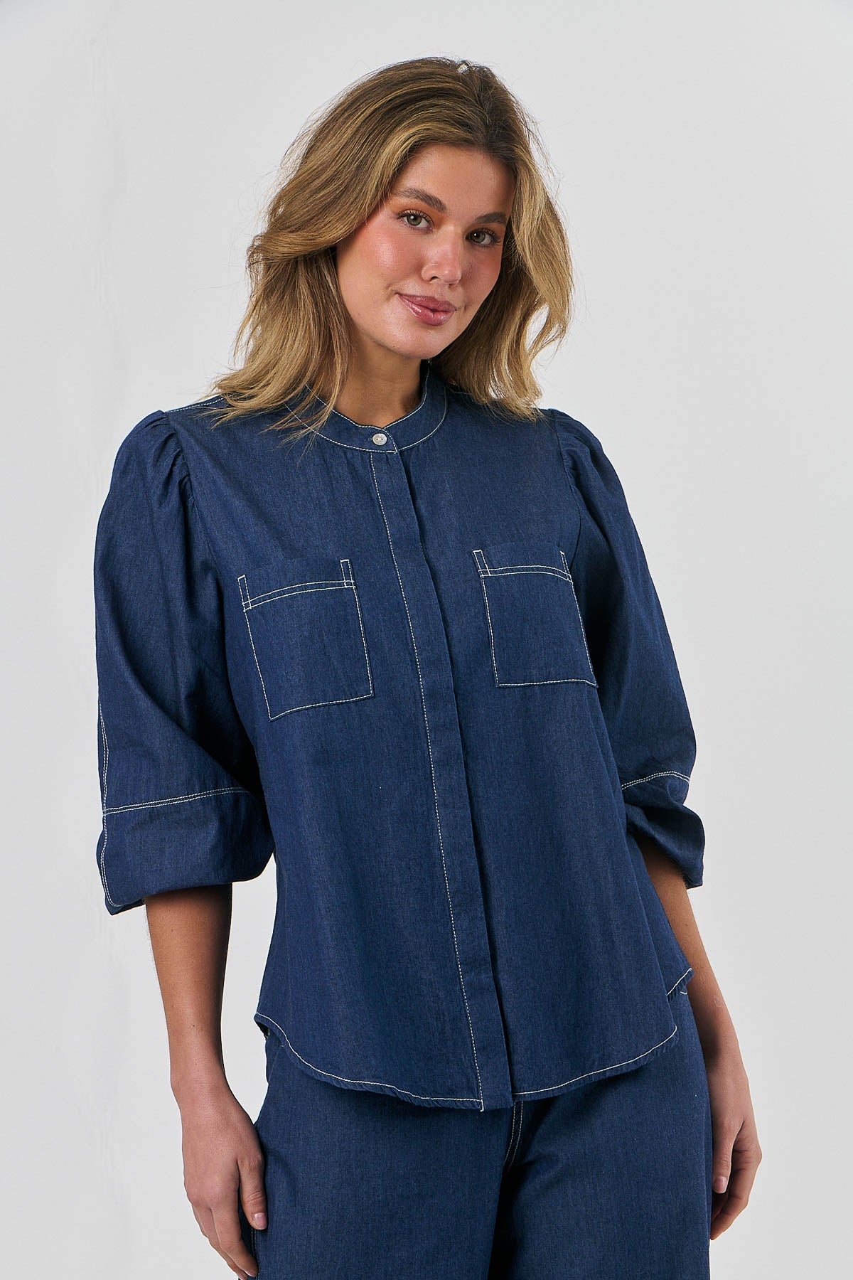 Naturals by O&J Contrasting Stitch Shirt in Dark Denim Blue with long sleeves and curved hem with a grandpa collar.