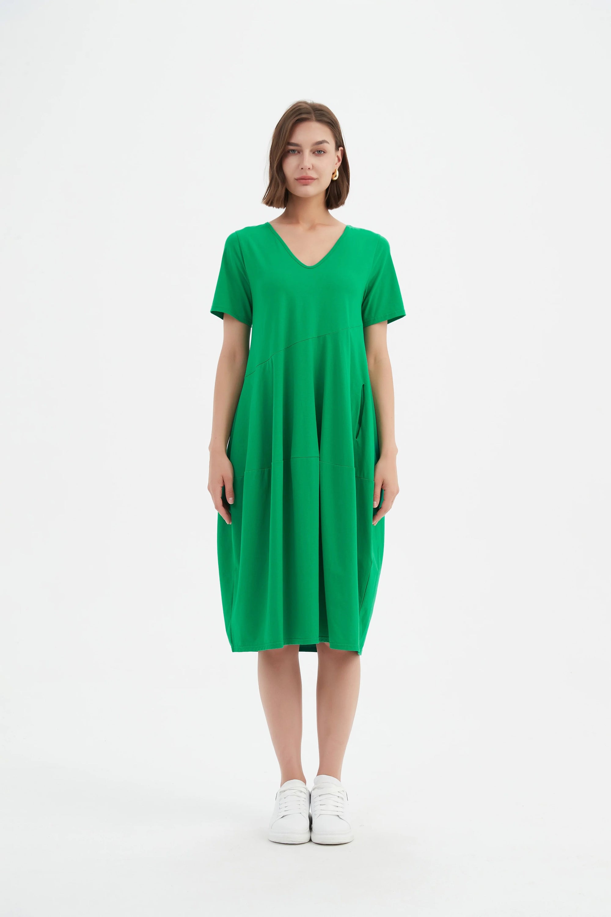 Women's green midi dress with V Neck, short sleeves and a diagonal seam by Tirelli.