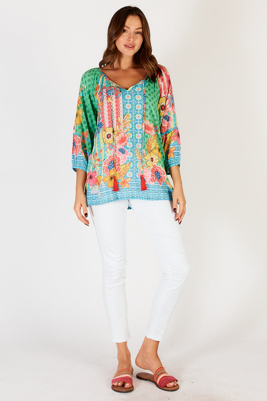 Miranda Blouse Top with 3/4 sleeves, v-neck with tassels, contrasting print on cuffs, hem and placket with floral and geometric print by LulaLife. 