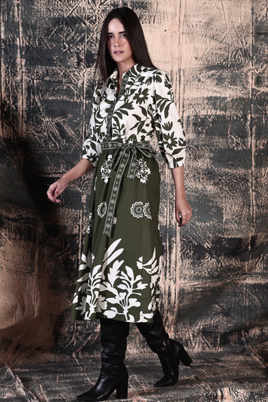 Side View of ladies Remi Dress in Olive Green and White with a leafy print and below knee length by Maude Vivante.