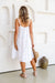 Back of Free Angel flirty dress in White linen midi dress with tiered skirt, 