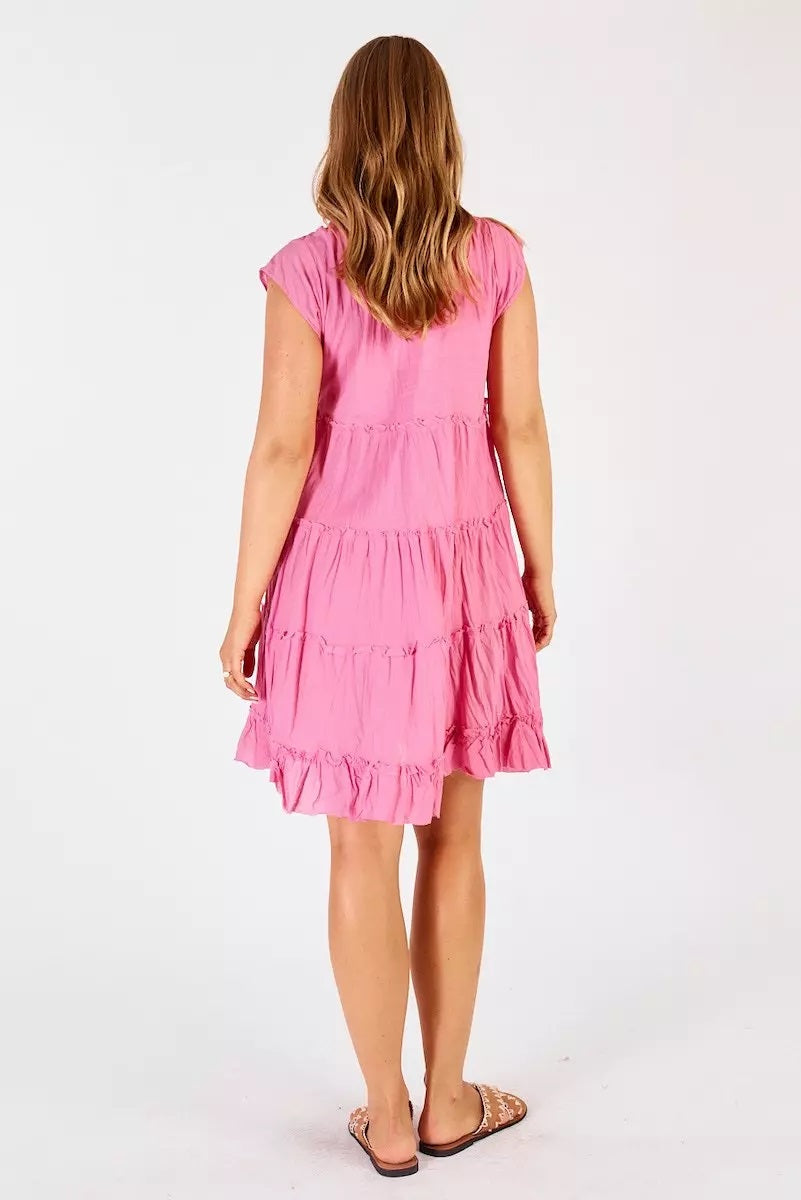 Back of Gwen tiered midi dress by lulalife in candy pink with 4 tiers with slight ruffling.