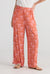 Red and pink block palm tree print trousers by Holiday.